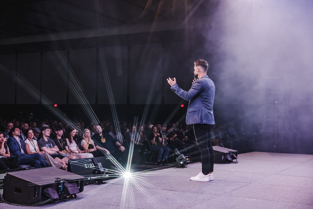 Bridger Pennington speaking to an audience at a Fund Launch event